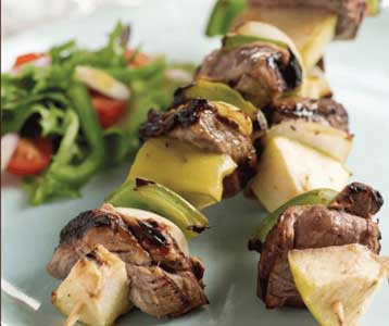 Grilled beef and vegetable kebabs with salad on the side